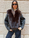 Giacca nera con pelo marrone